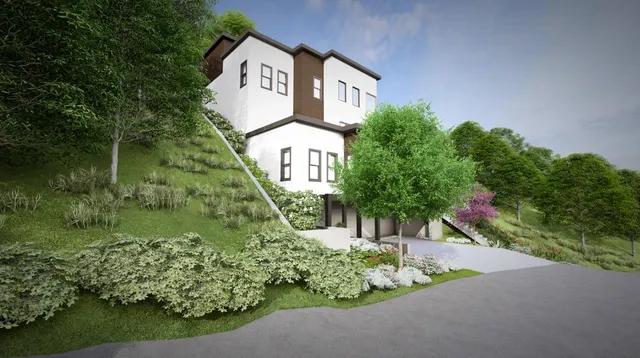 a front view of a house with garden