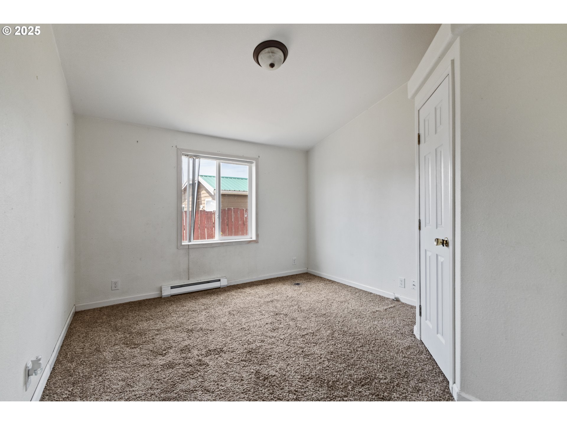 1829 East Willow Street Myrtle Point, OR 97458 - Photo 18 of 37 a view of an empty room with window