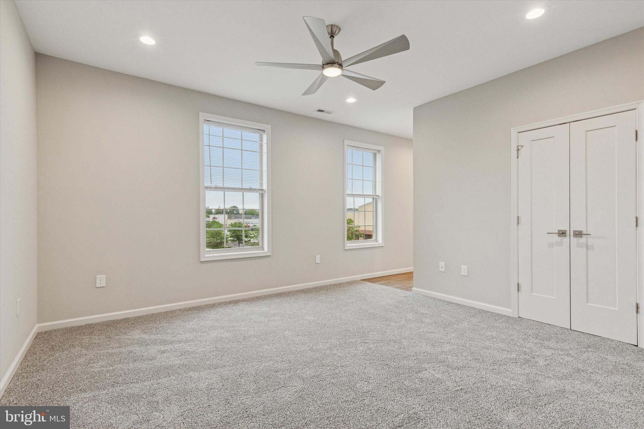 3238 Ridge Pike, Unit A Eagleville, PA 19403 - Photo 3 of 14 an empty room with windows and fan