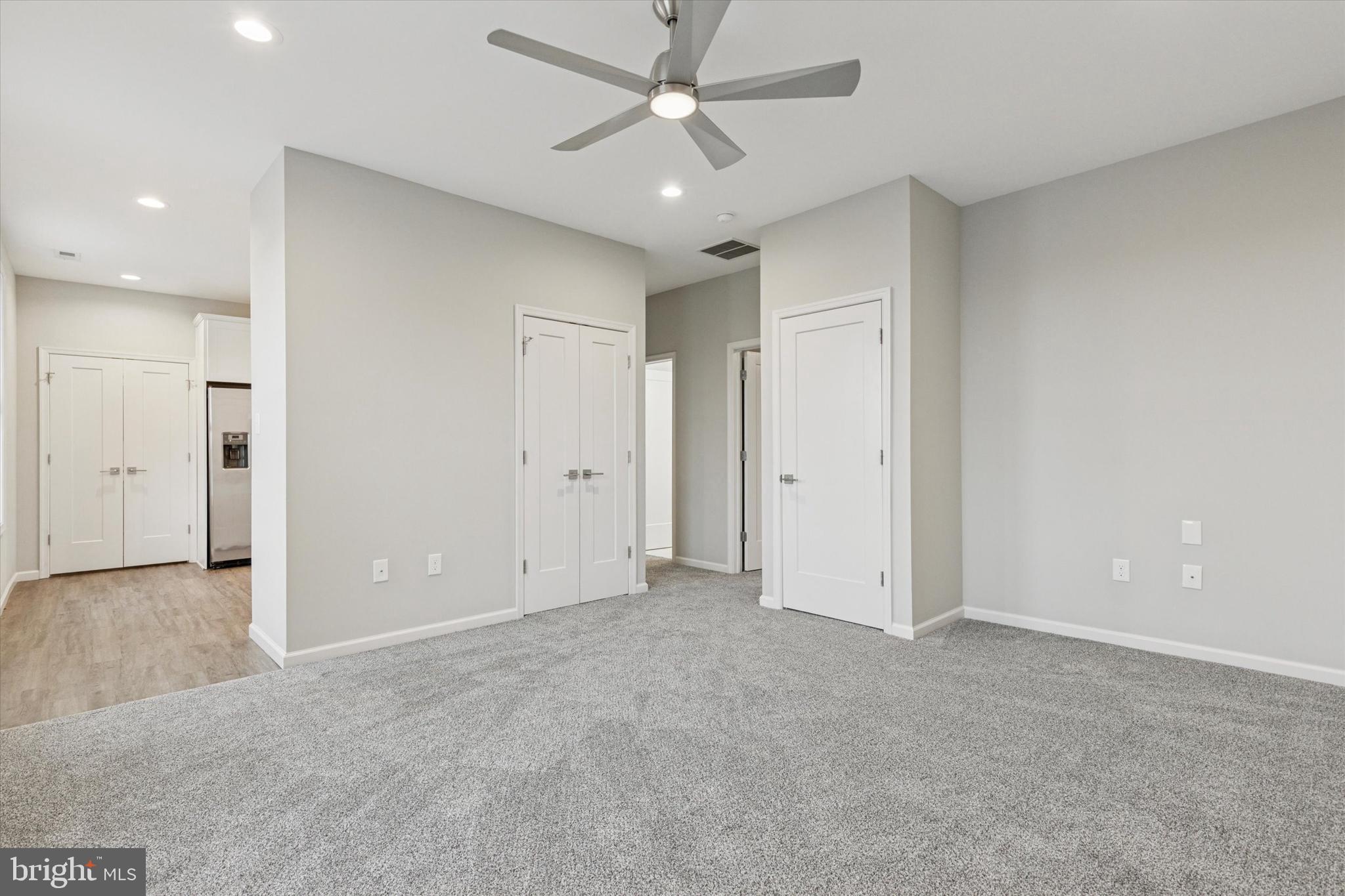 3238 Ridge Pike, Unit A Eagleville, PA 19403 - Photo 4 of 14 an empty room with fan and ceiling fan