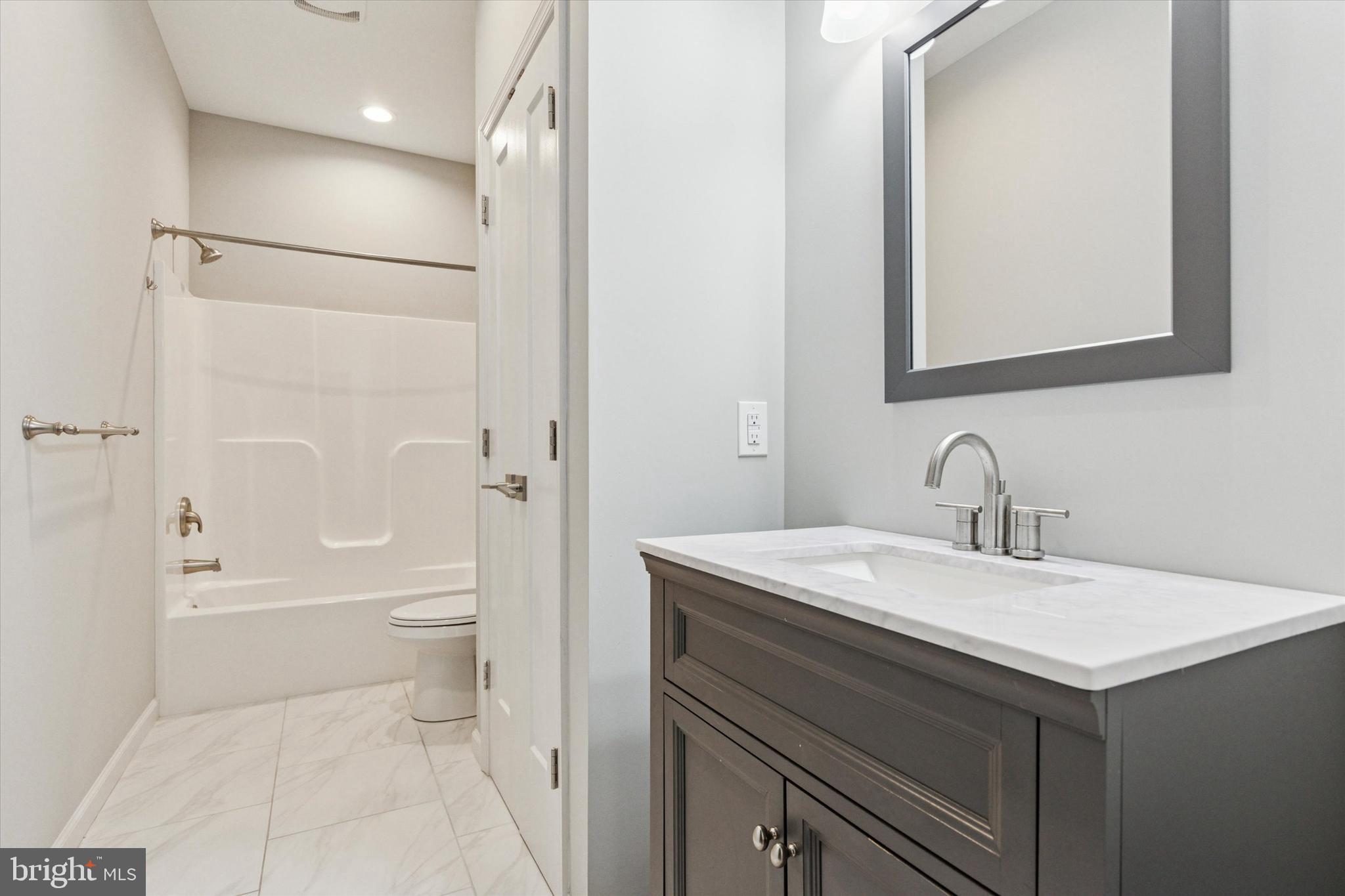 3238 Ridge Pike, Unit A Eagleville, PA 19403 - Photo 8 of 14 a bathroom with a sink toilet vanity and shower