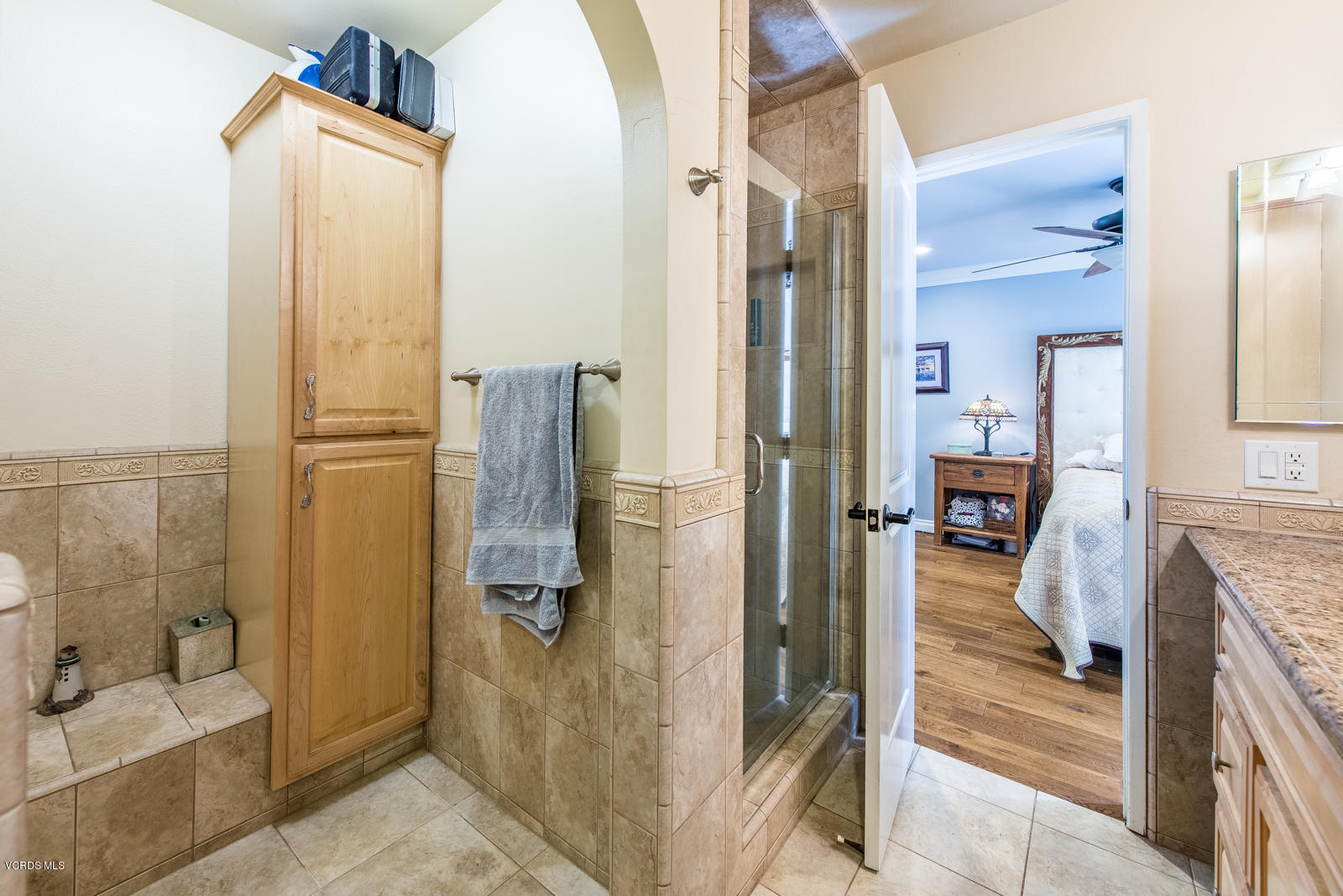 1610 Rambling Road Simi Valley, CA 93065 - Photo 15 of 26 a bathroom with a tub shower and a sink