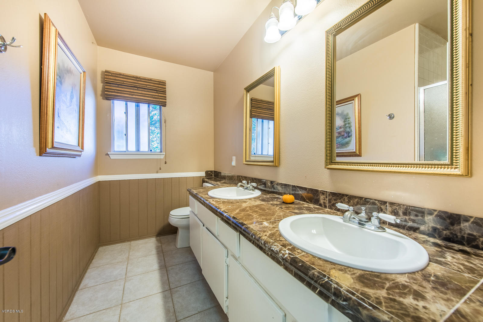 1610 Rambling Road Simi Valley, CA 93065 - Photo 17 of 26 a bathroom with a granite countertop double vanity sink and a bathtub