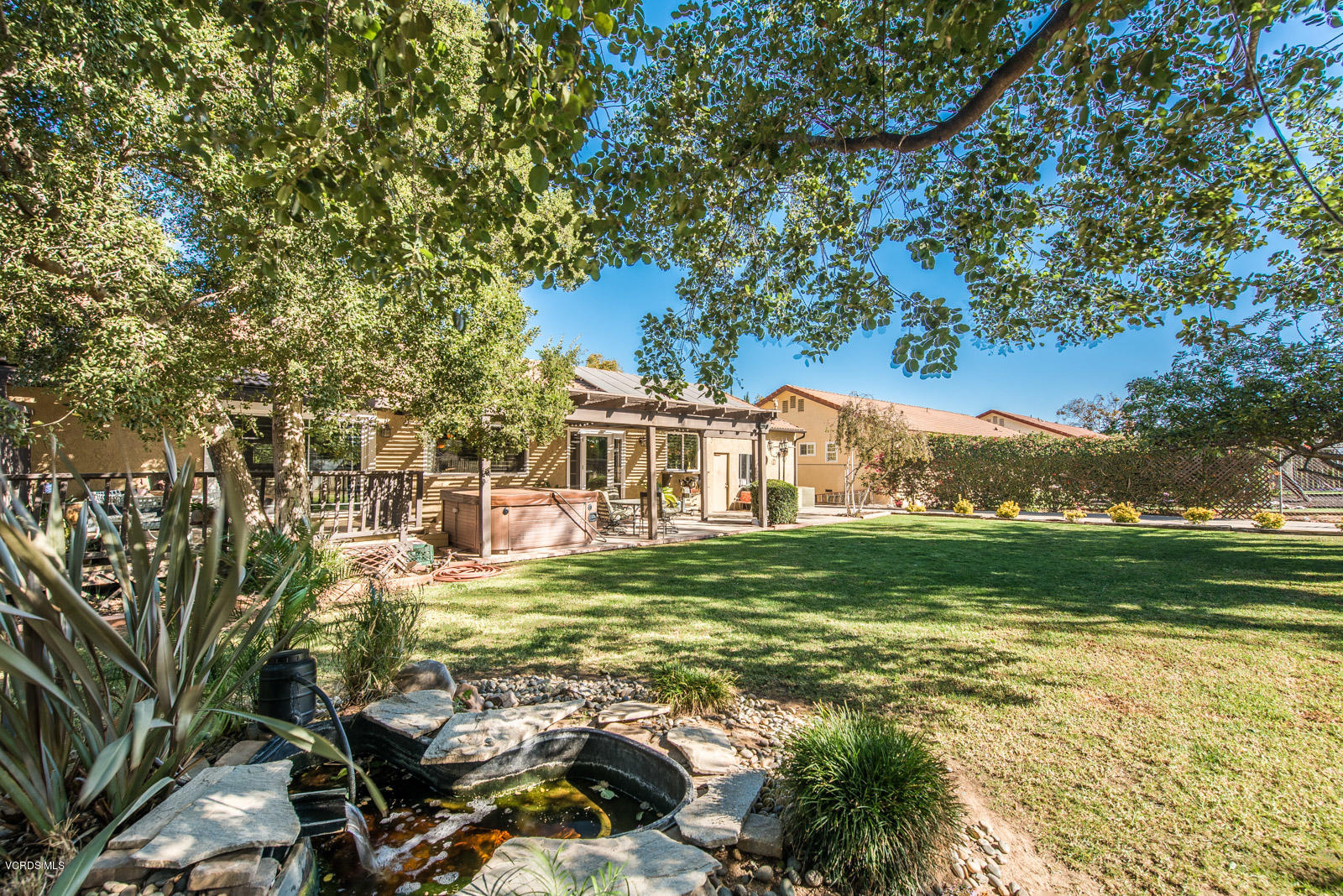 1610 Rambling Road Simi Valley, CA 93065 - Photo 20 of 26 a view of a big yard with table and chairs and potted plants