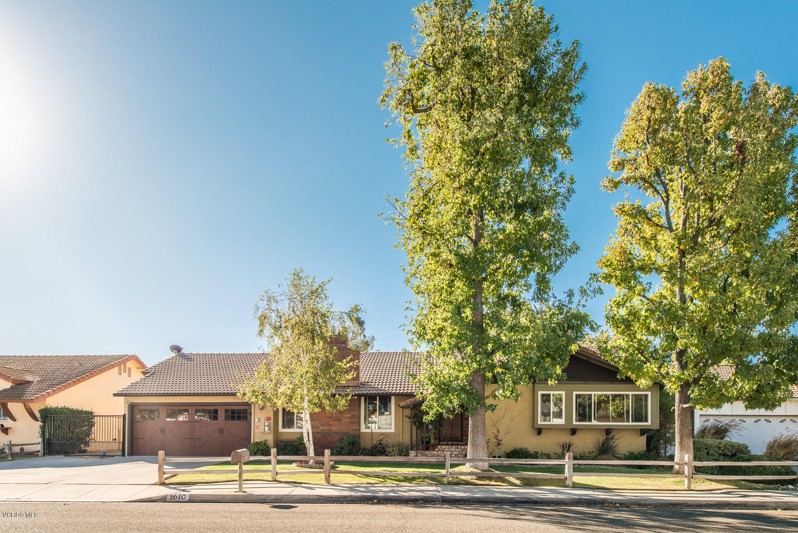 1610 Rambling Road Simi Valley, CA 93065 - Photo 3 of 26 a front view of a house with a yard