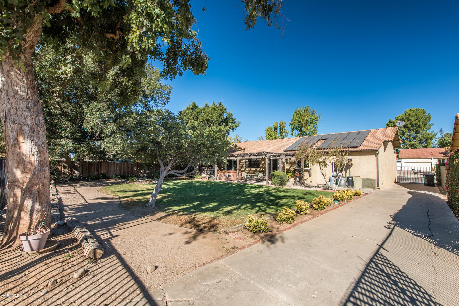 1610 Rambling Road Simi Valley, CA 93065 - Photo 21 of 26 a view of a house with a yard and potted plants