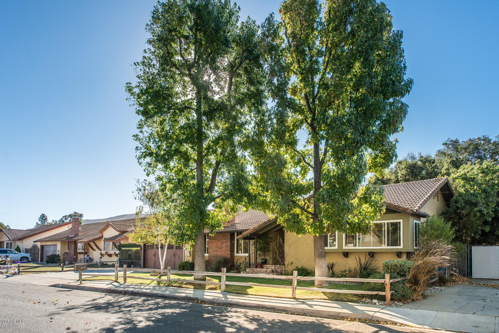 1610 Rambling Road Simi Valley, CA 93065 - Photo 4 of 26 a front view of a house with a yard