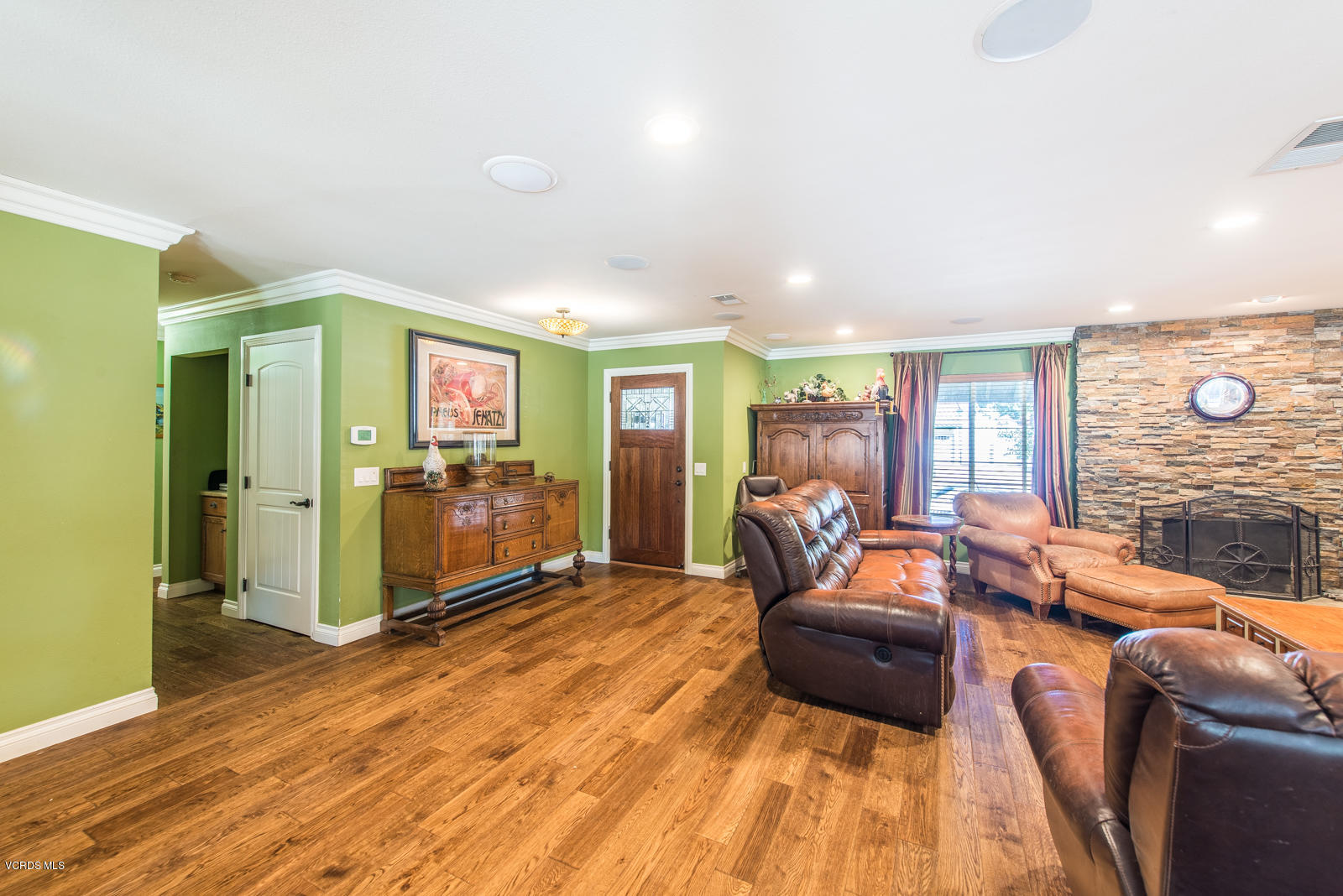 1610 Rambling Road Simi Valley, CA 93065 - Photo 6 of 26 a living room with furniture and a flat screen tv