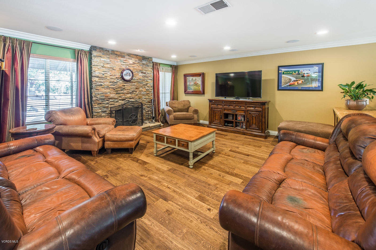1610 Rambling Road Simi Valley, CA 93065 - Photo 7 of 26 a living room with furniture and a flat screen tv