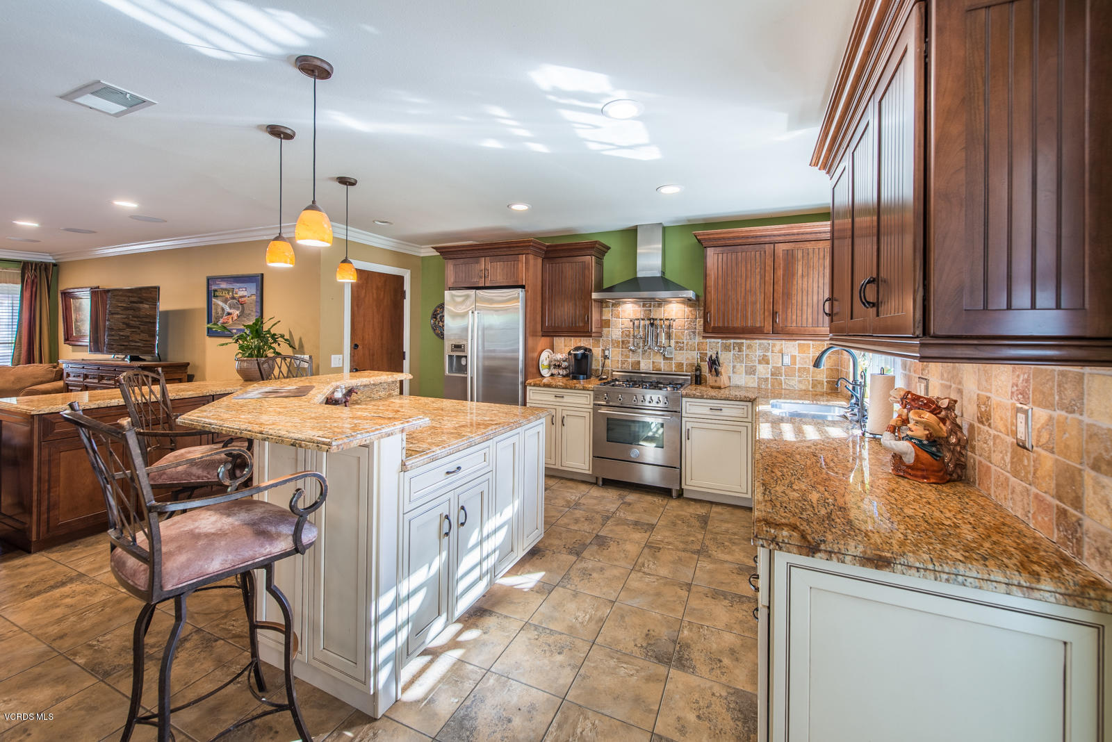 1610 Rambling Road Simi Valley, CA 93065 - Photo 9 of 26 a kitchen with stainless steel appliances granite countertop a sink a stove and a refrigerator