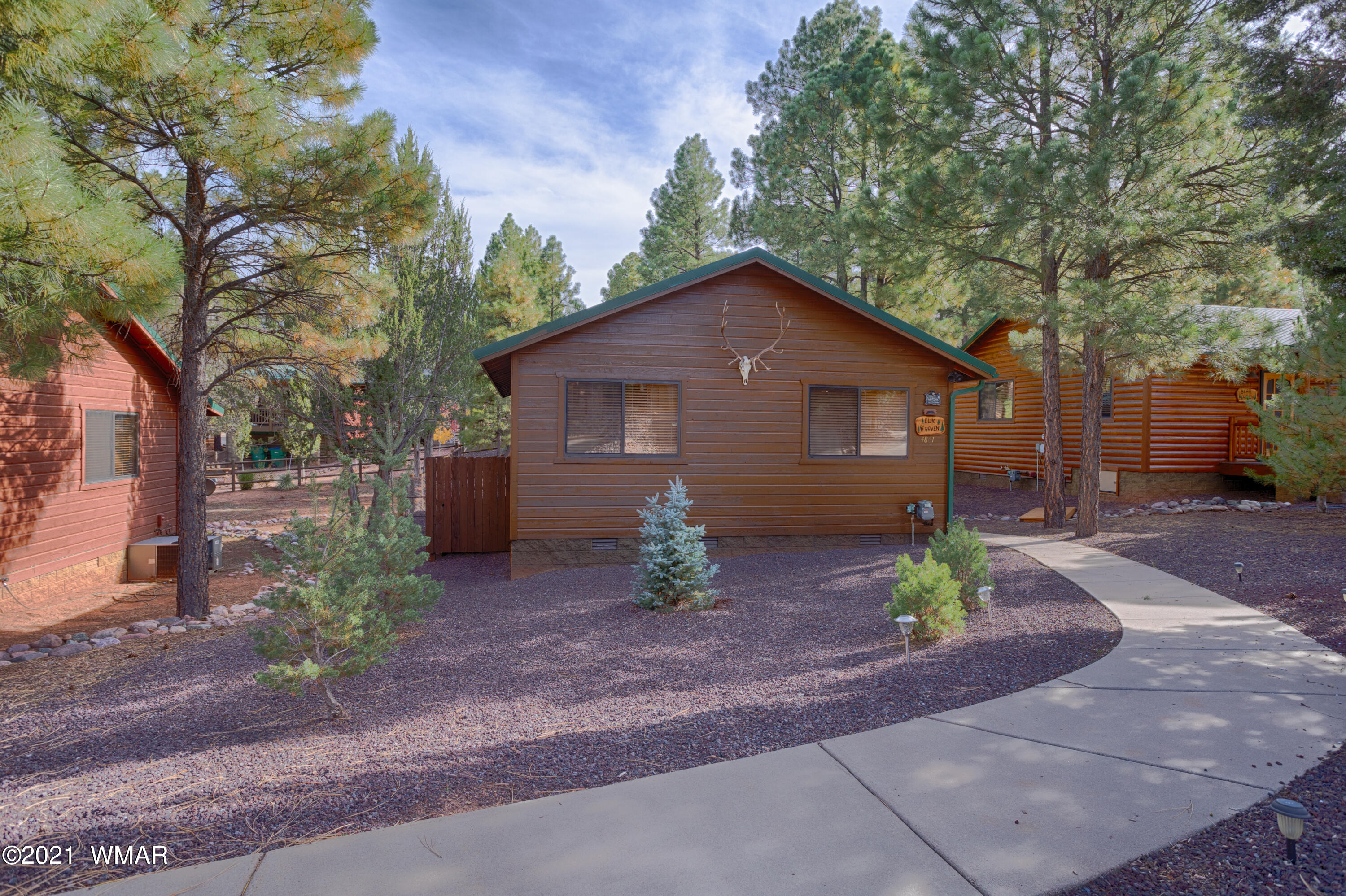4861 West Cottage Loop Show Low, AZ 85901 - Photo 11 of 35 a front view of a house with garden