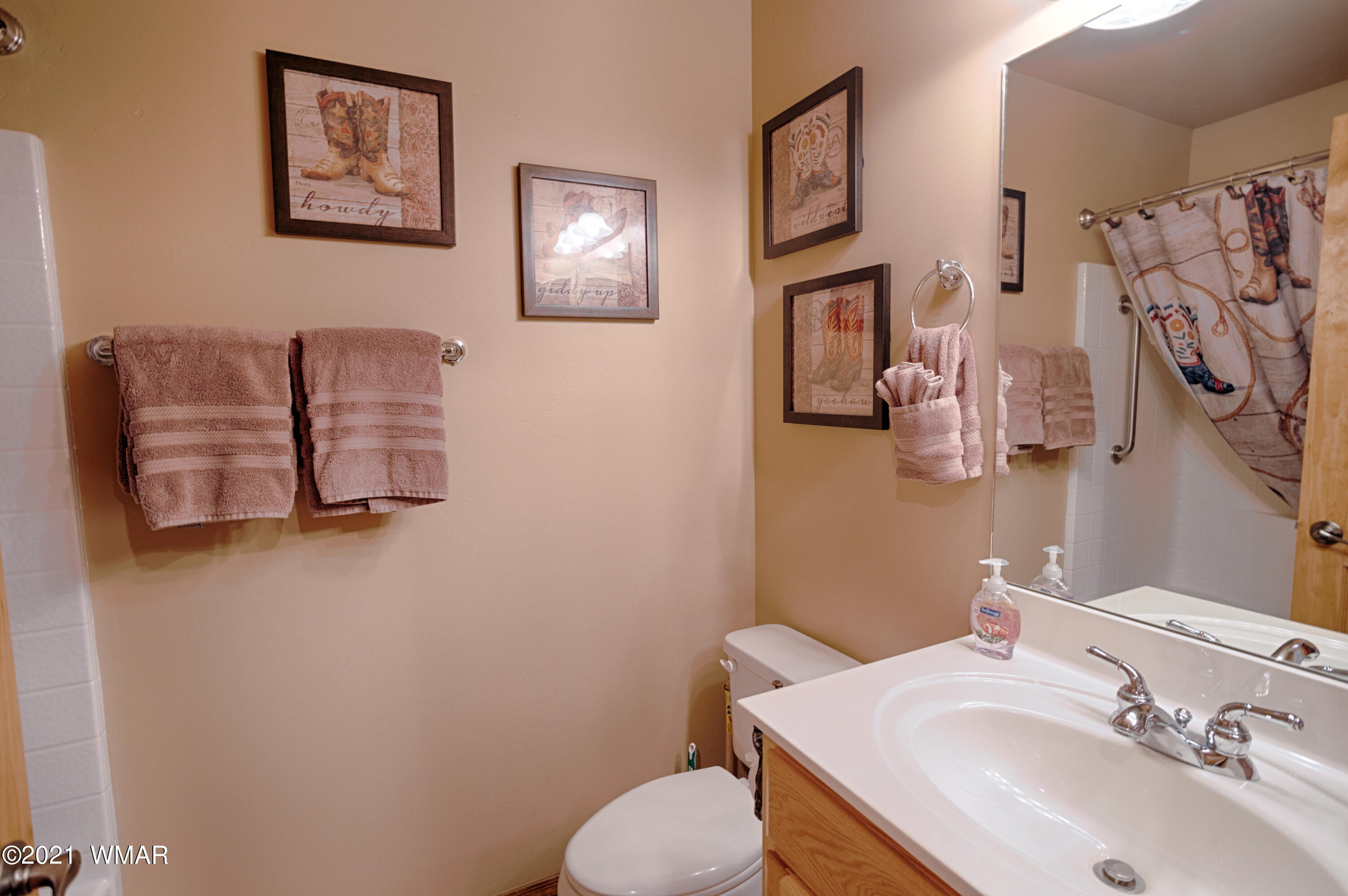 4861 West Cottage Loop Show Low, AZ 85901 - Photo 13 of 35 a bathroom with a sink mirror and toilet