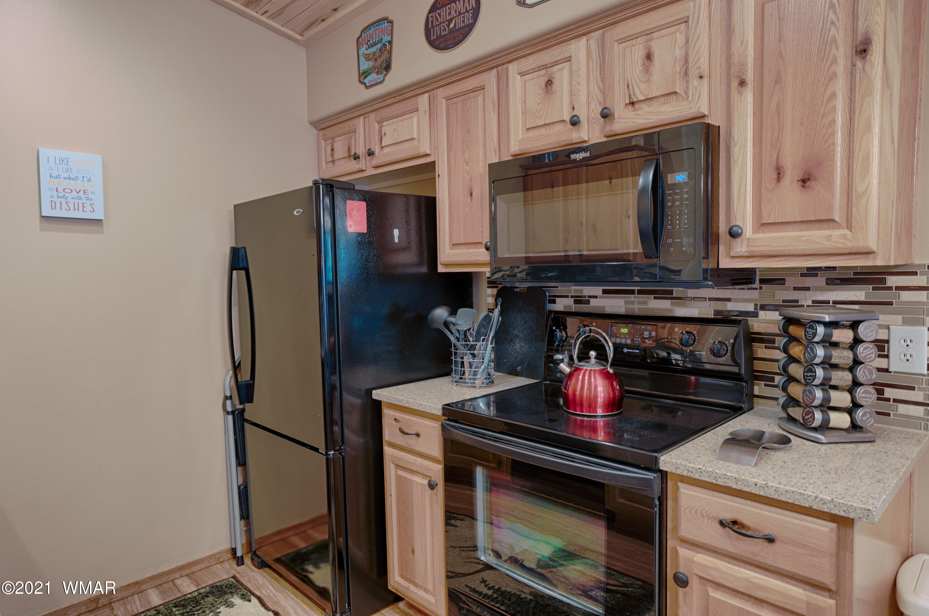 4861 West Cottage Loop Show Low, AZ 85901 - Photo 4 of 35 a kitchen with stainless steel appliances granite countertop a stove and a refrigerator