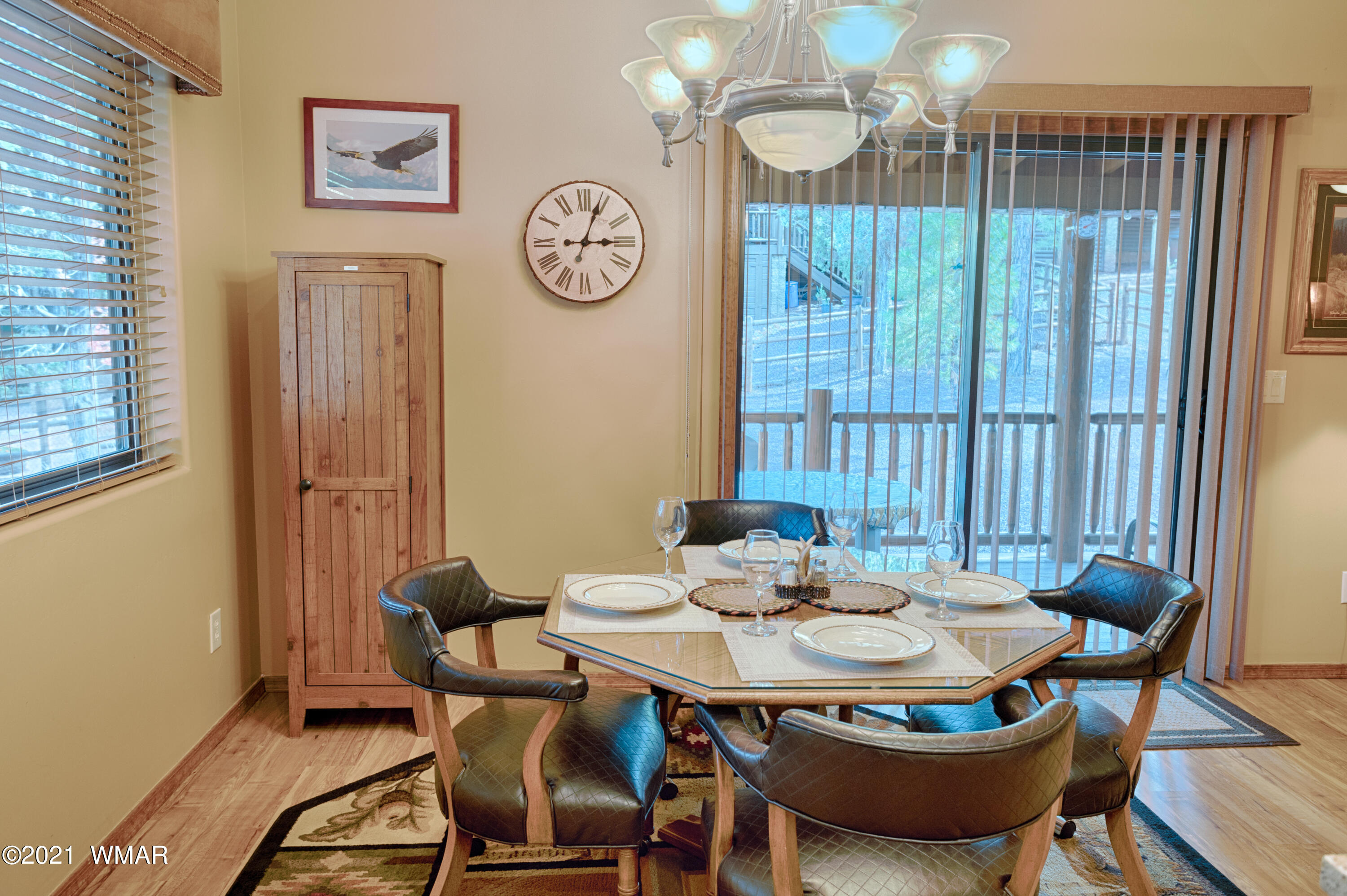 4861 West Cottage Loop Show Low, AZ 85901 - Photo 5 of 35 a view of a dining room with furniture window and wooden floor