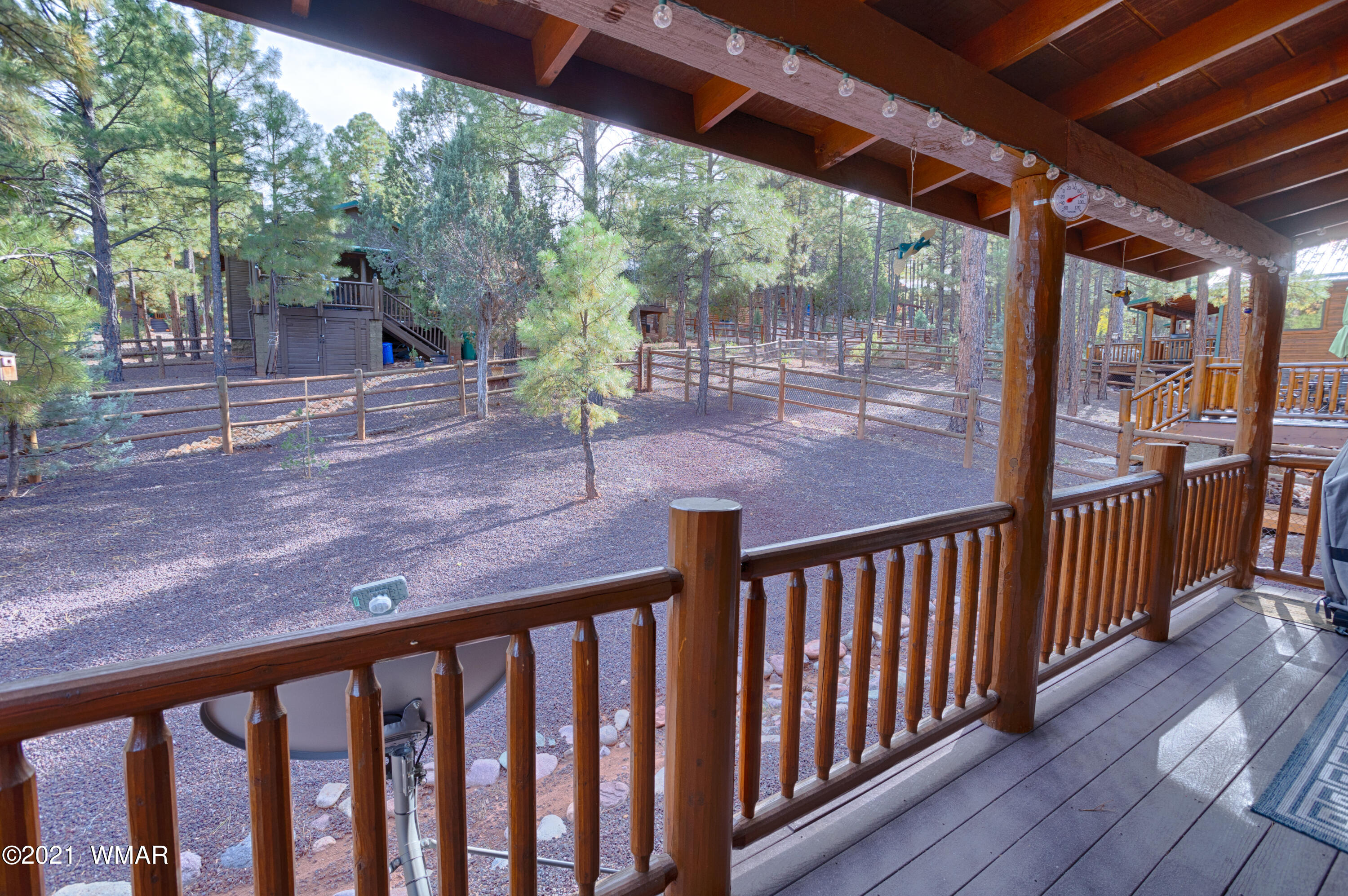 4861 West Cottage Loop Show Low, AZ 85901 - Photo 9 of 35 a view of a porch with wooden floor and outdoor space