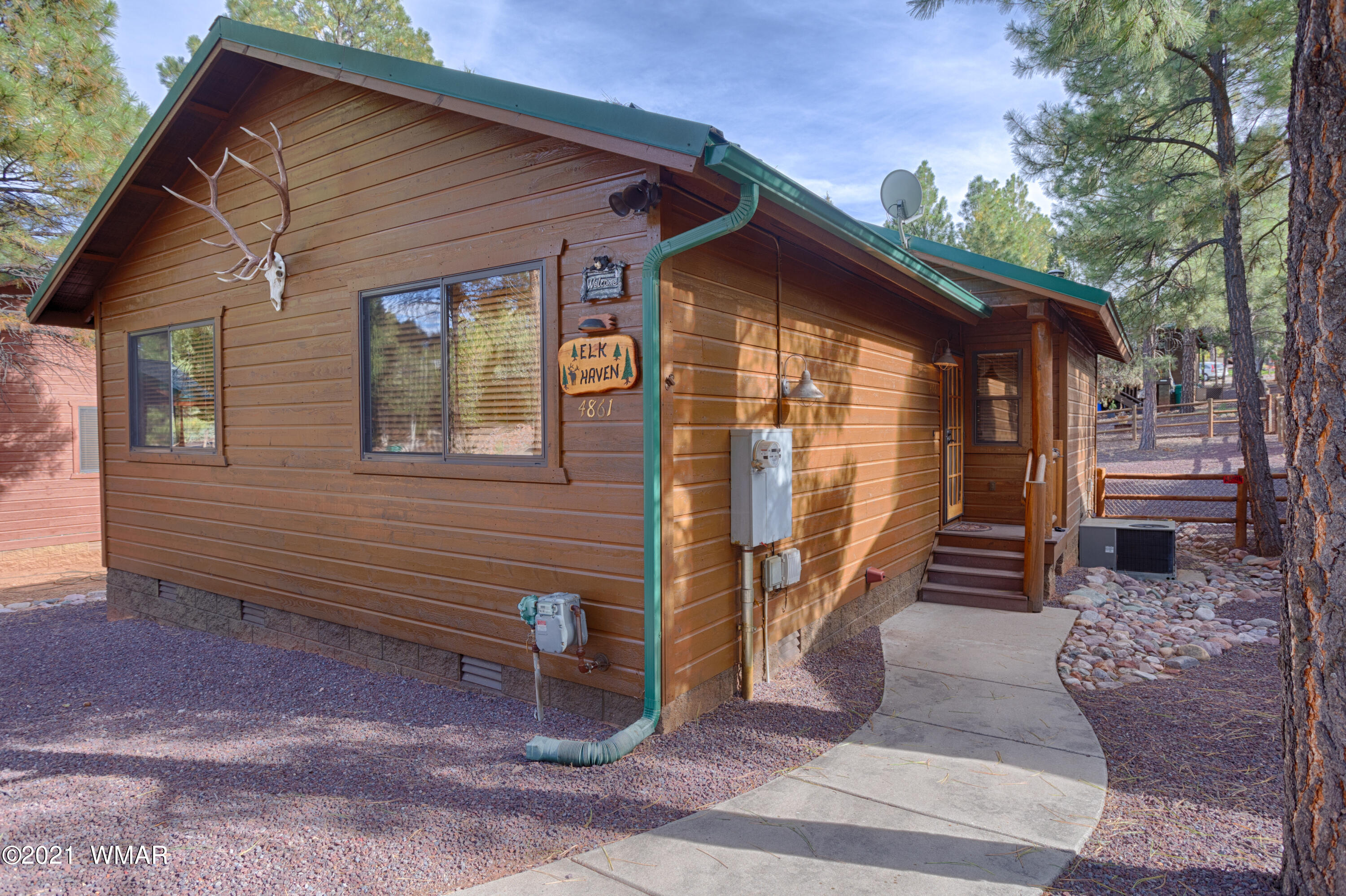4861 West Cottage Loop Show Low, AZ 85901 - Photo 10 of 35 a view of a house with a yard