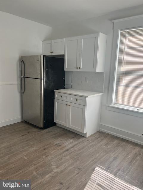 102 Chestnut Street Audubon, NJ 08106 - Photo 4 of 15 a kitchen with a refrigerator a stove top oven and cabinets