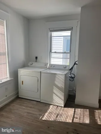 a view of a kitchen with a sink dishwasher and a window