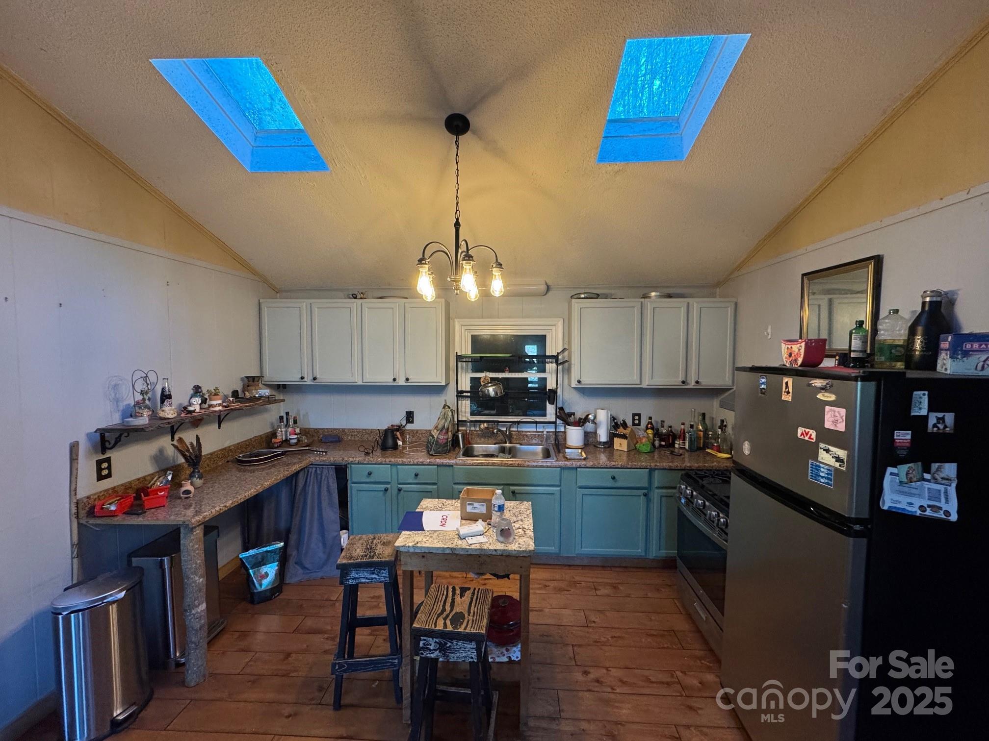 269 East View Road Sylva, NC 28779 - Photo 12 of 28 a kitchen with kitchen island granite countertop lots of counter top space