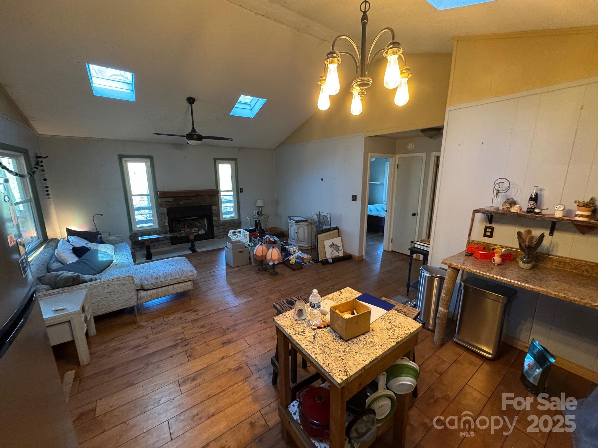 269 East View Road Sylva, NC 28779 - Photo 10 of 28 a living room with furniture and a chandelier