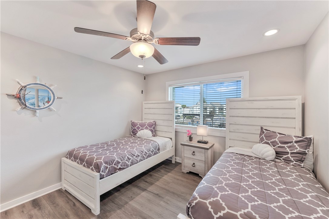 230 Cut-Off Road, Unit 204 Port Aransas, TX 78373 - Photo 15 of 37 a bedroom with a bed and window