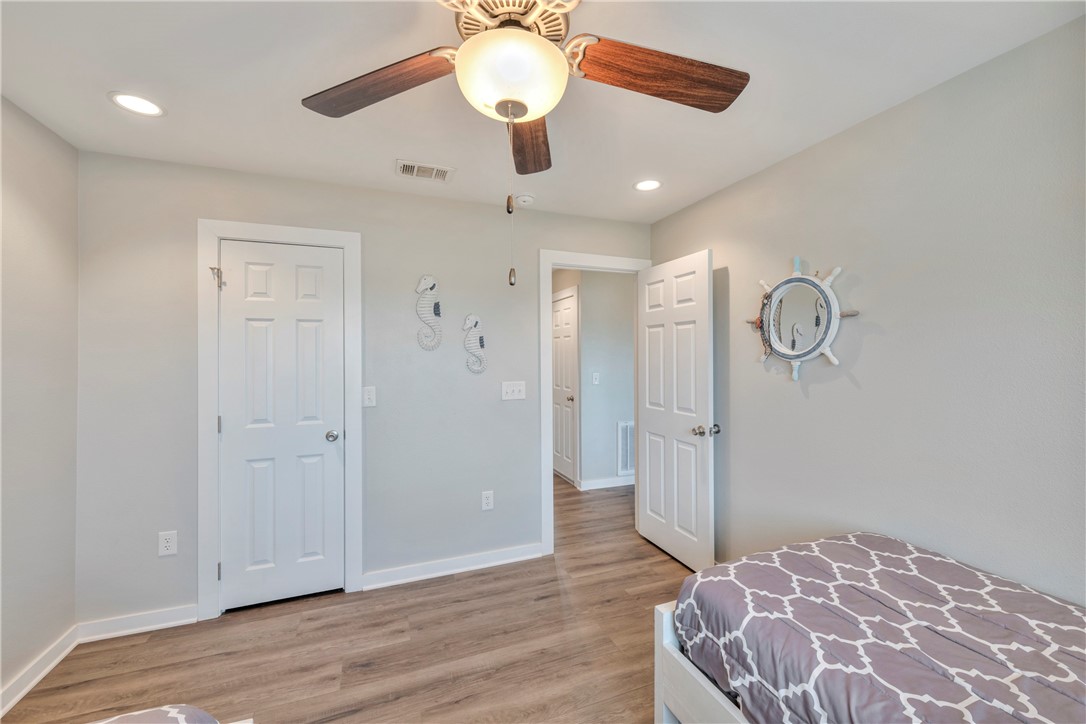 230 Cut-Off Road, Unit 204 Port Aransas, TX 78373 - Photo 16 of 37 a view of a hallway with wooden floor