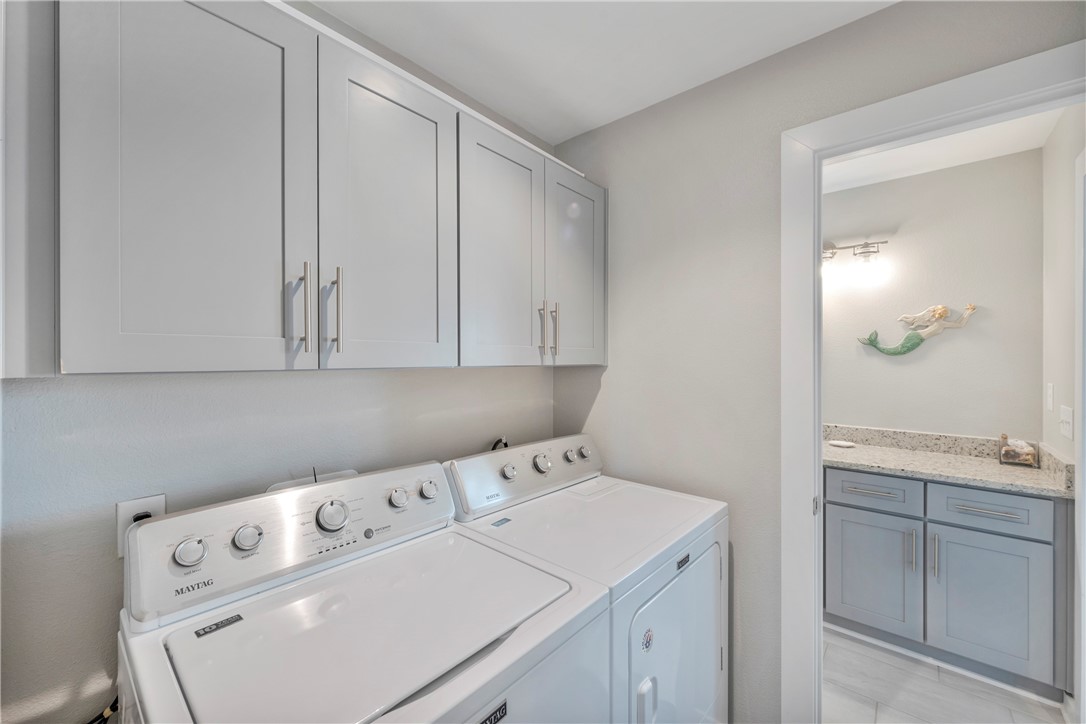 230 Cut-Off Road, Unit 204 Port Aransas, TX 78373 - Photo 17 of 37 a utility room with dryer and washer