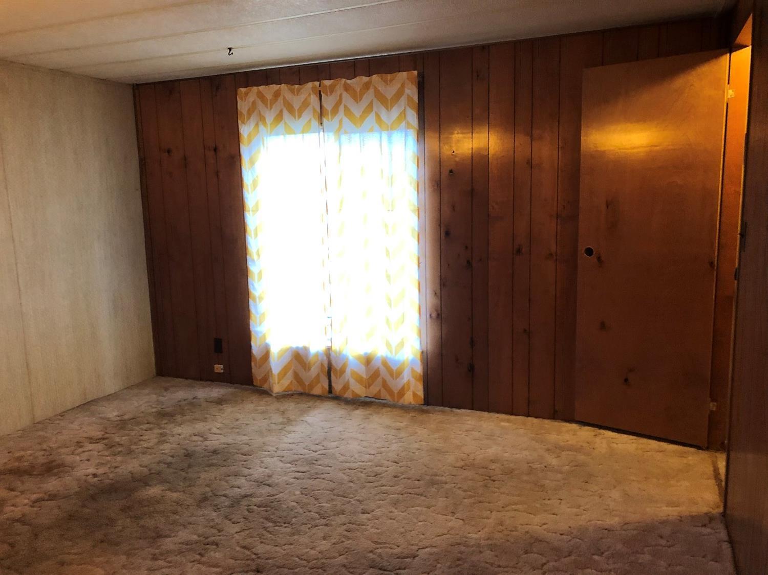 6226 East Evans Creek Road, Unit 15 Rogue River, OR 97537 - Photo 20 of 30 a view of an empty room with a window