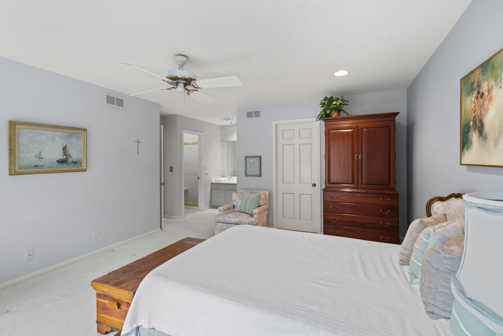 715 Tomlin Drive, Unit A1 Burr Ridge, IL 60527 - Photo 16 of 24 a bedroom with a bed and a chandelier