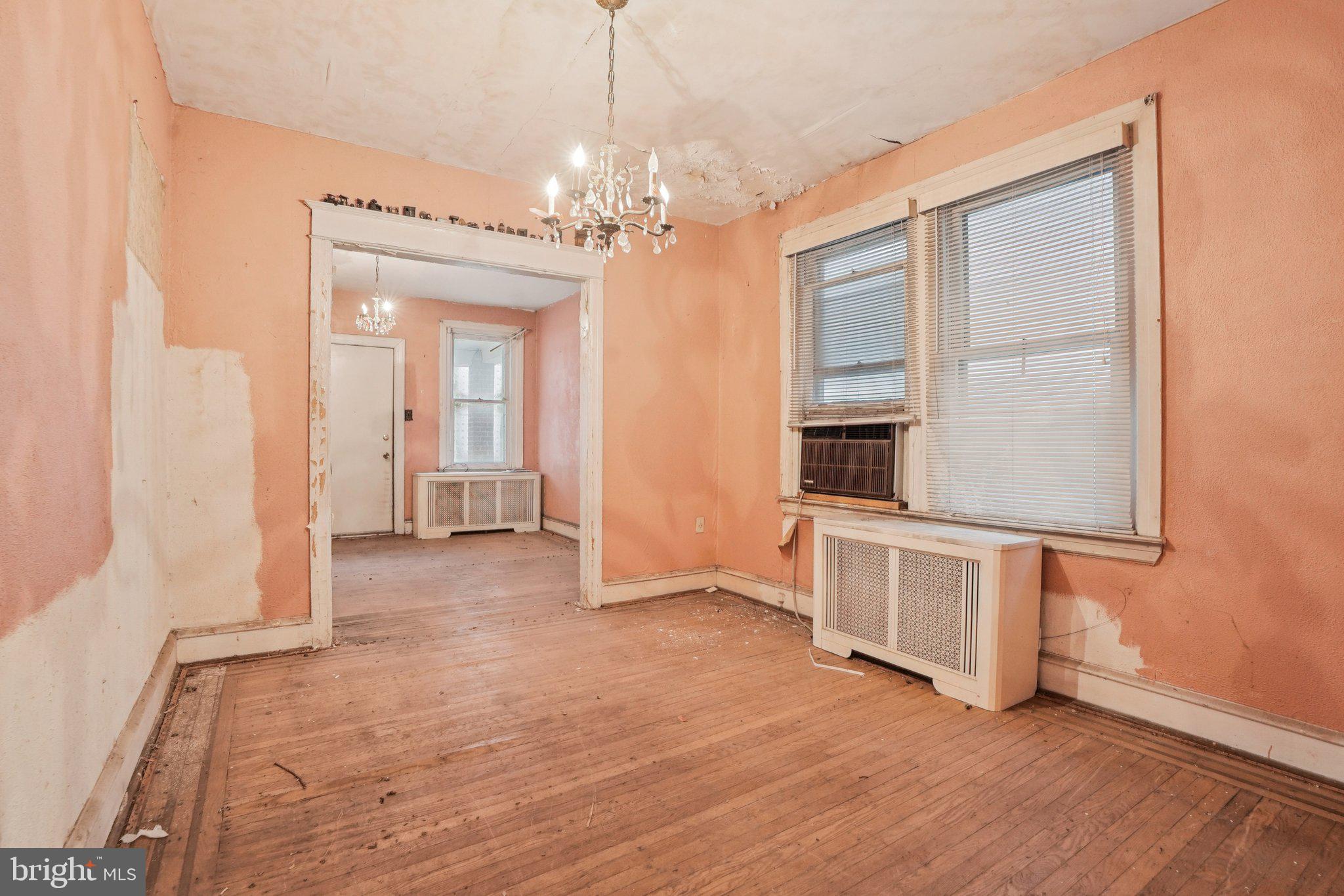 5322 James Street Philadelphia, PA 19137 - Photo 11 of 40 a view of a room with wooden floor and chandelier