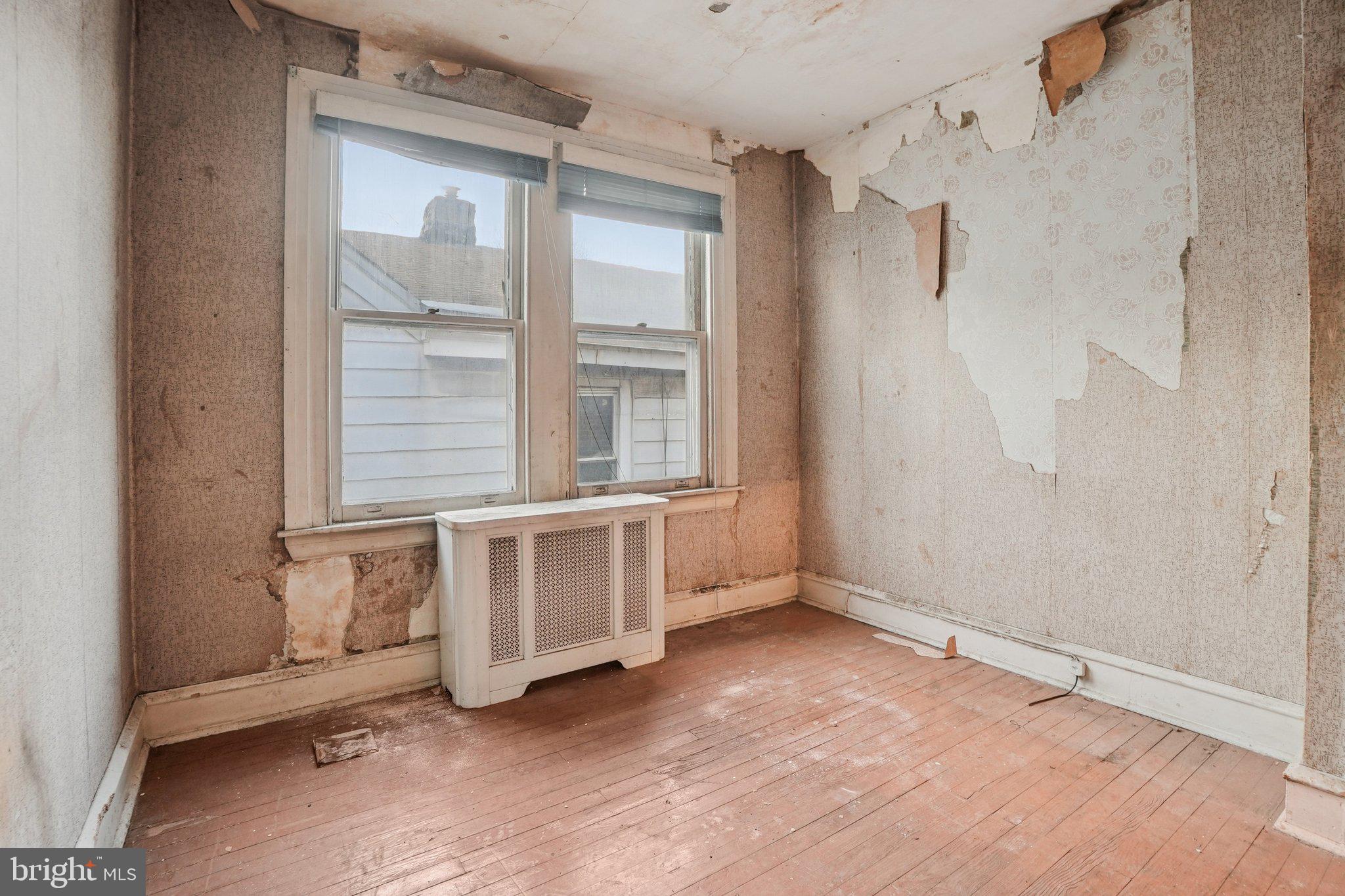 5322 James Street Philadelphia, PA 19137 - Photo 23 of 40 a view of an empty room with cabinet and windows