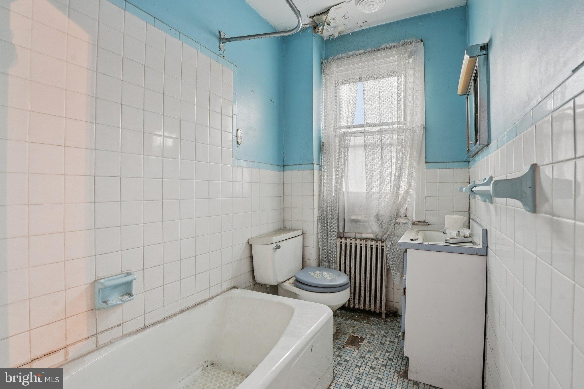 5322 James Street Philadelphia, PA 19137 - Photo 24 of 40 a bathroom with a sink a toilet and tub