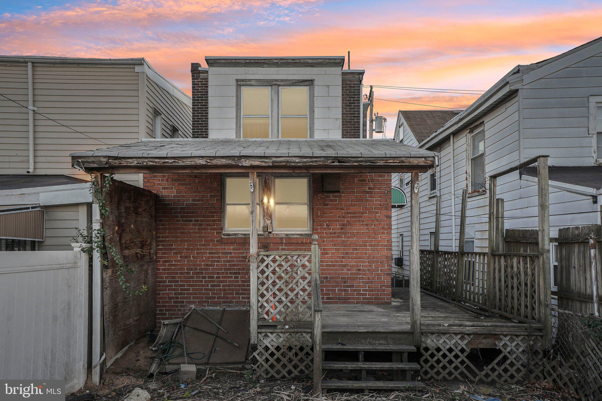 5322 James Street Philadelphia, PA 19137 - Photo 36 of 40 a view of a brick house that has wooden fence