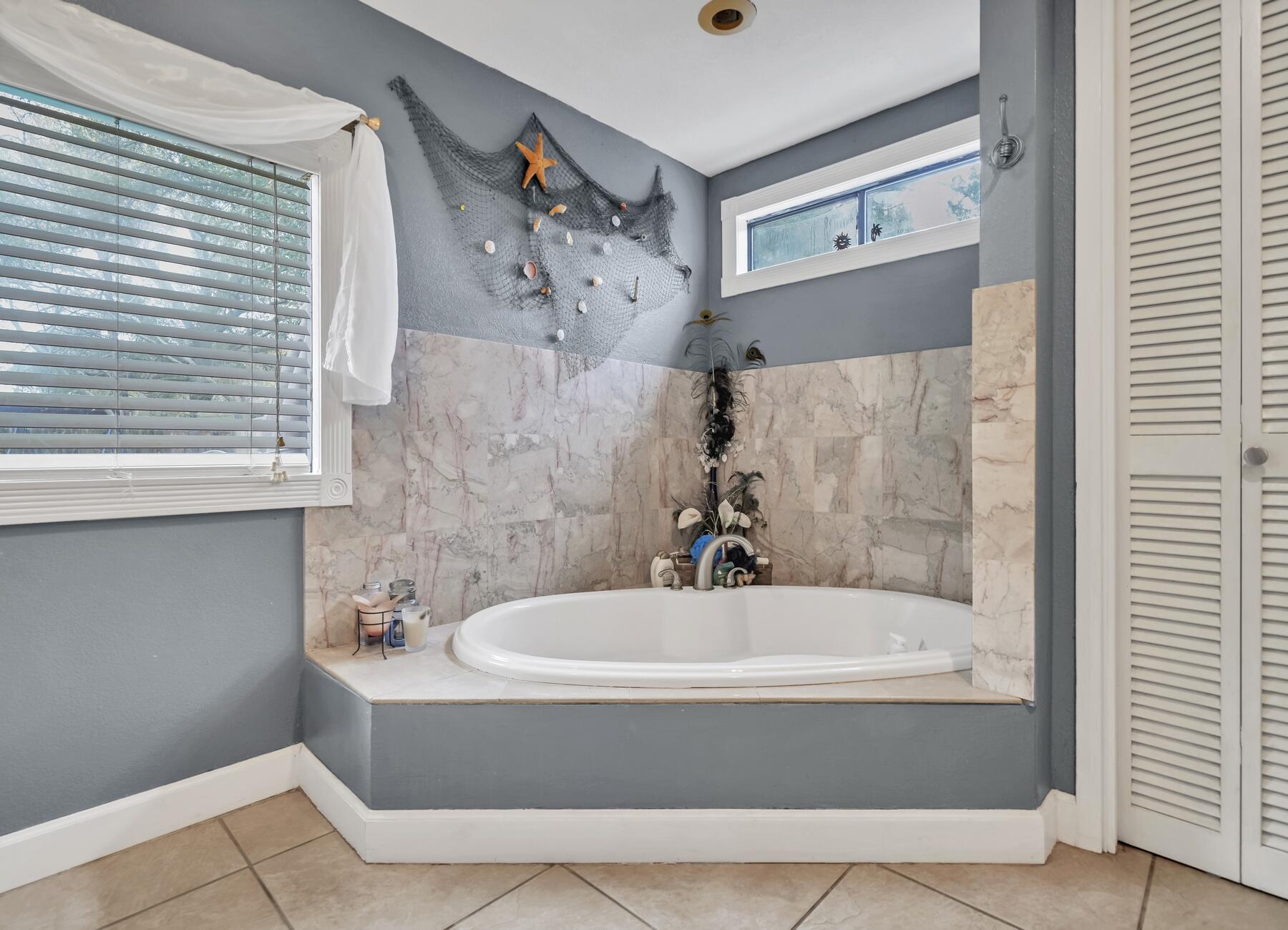 43 Ferry Road Northeast Fort Walton Beach, FL 32548 - Photo 16 of 23 a bathroom with a bathtub and shower