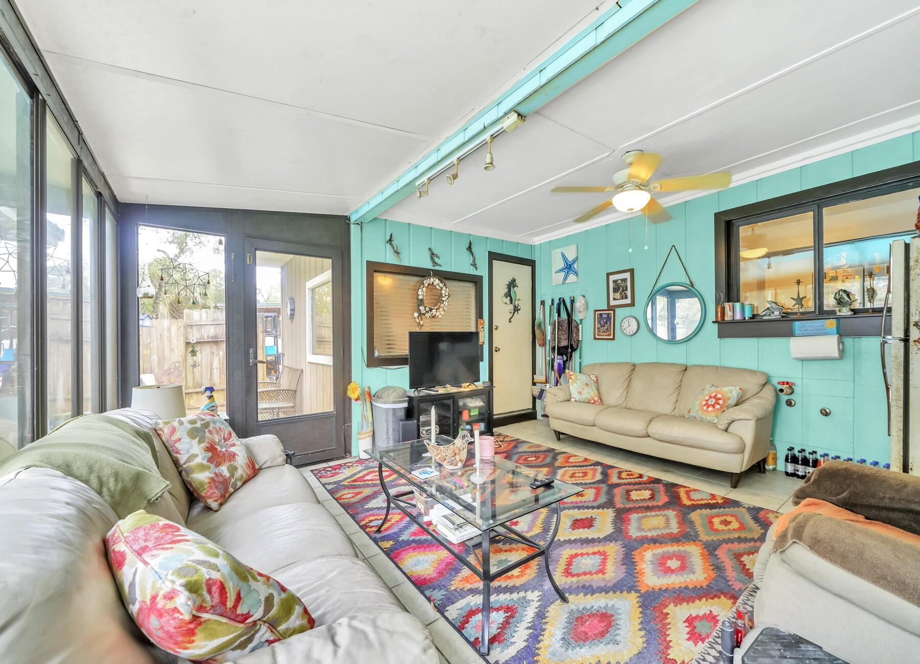 43 Ferry Road Northeast Fort Walton Beach, FL 32548 - Photo 19 of 23 a living room with furniture and a flat screen tv