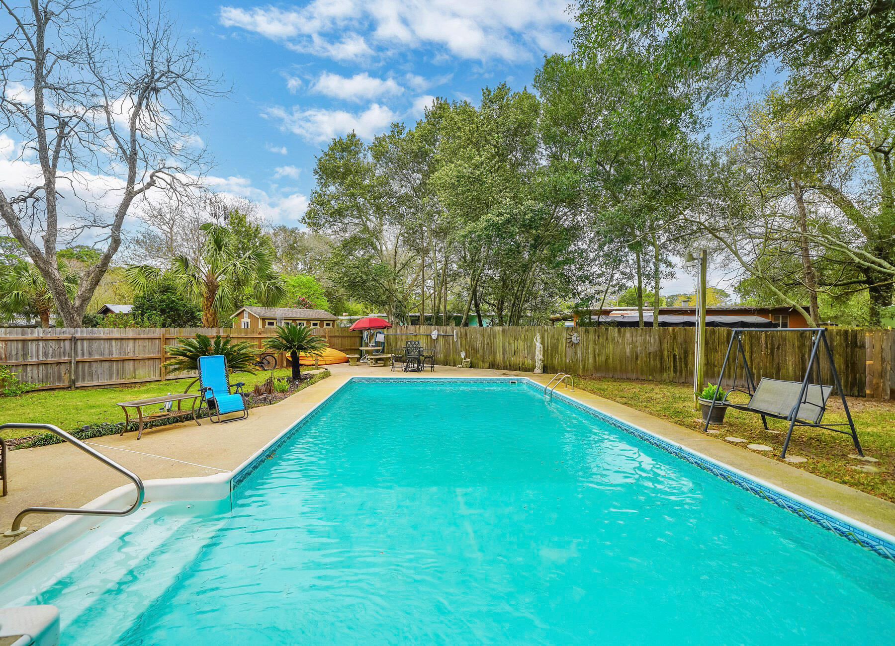 43 Ferry Road Northeast Fort Walton Beach, FL 32548 - Photo 21 of 23 a view of a swimming pool with a patio and a yard