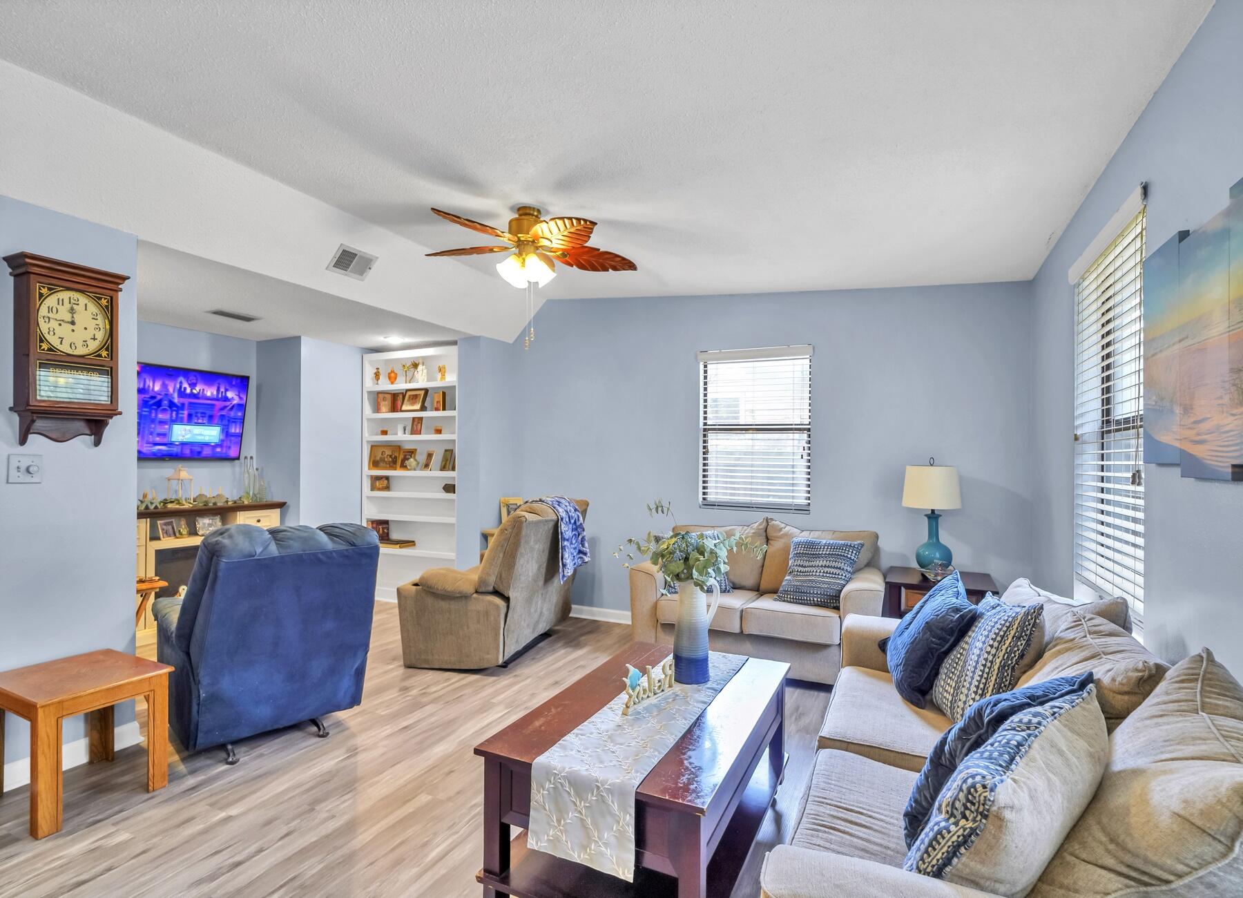 43 Ferry Road Northeast Fort Walton Beach, FL 32548 - Photo 6 of 23 a living room filled with furniture and a flat screen tv
