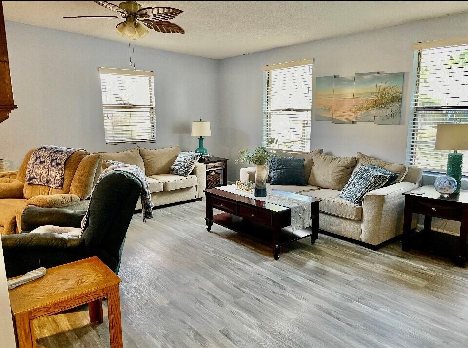 43 Ferry Road Northeast Fort Walton Beach, FL 32548 - Photo 7 of 23 a living room with furniture and a large window