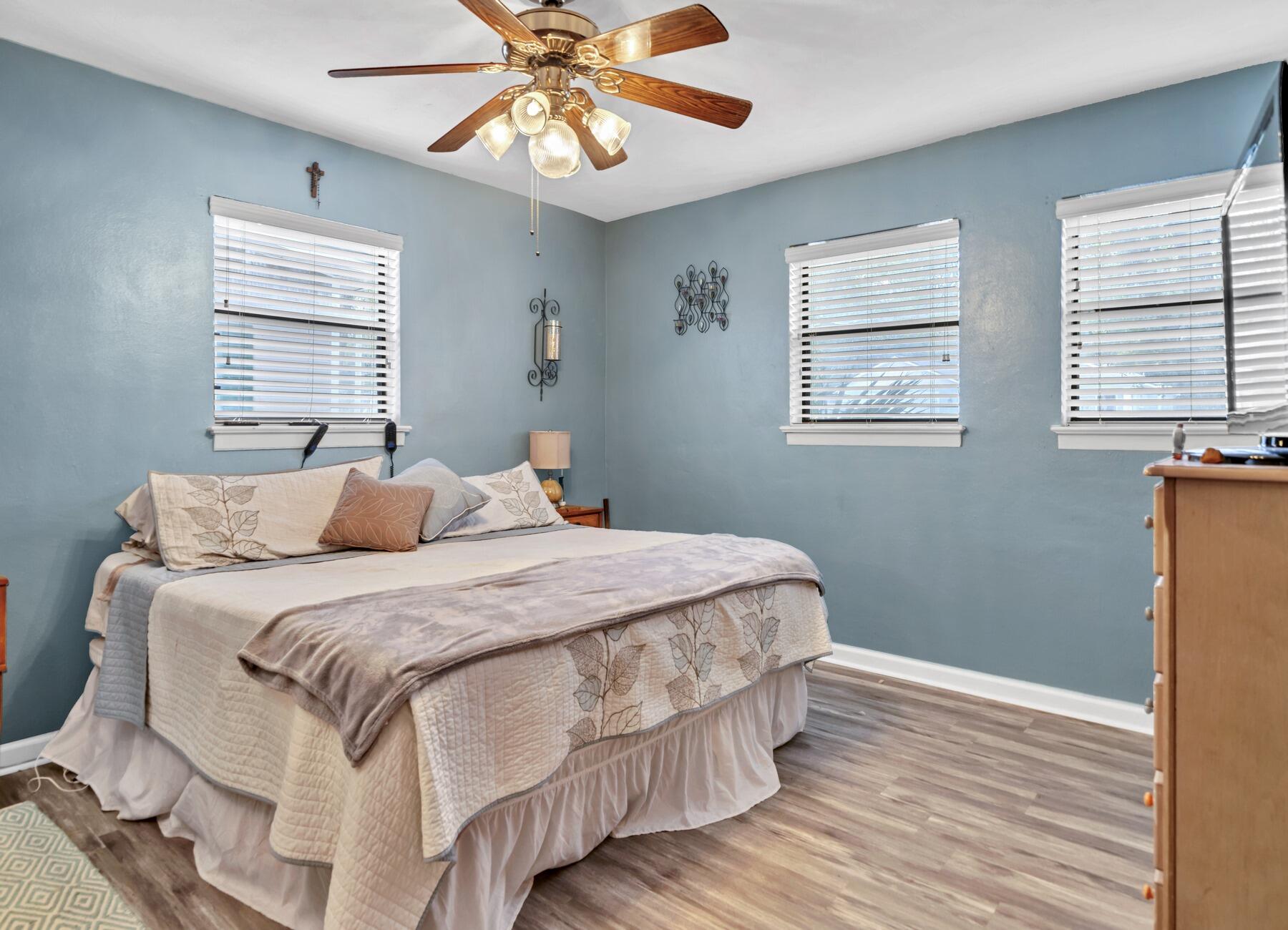 43 Ferry Road Northeast Fort Walton Beach, FL 32548 - Photo 9 of 23 a bedroom with a bed and wooden floor