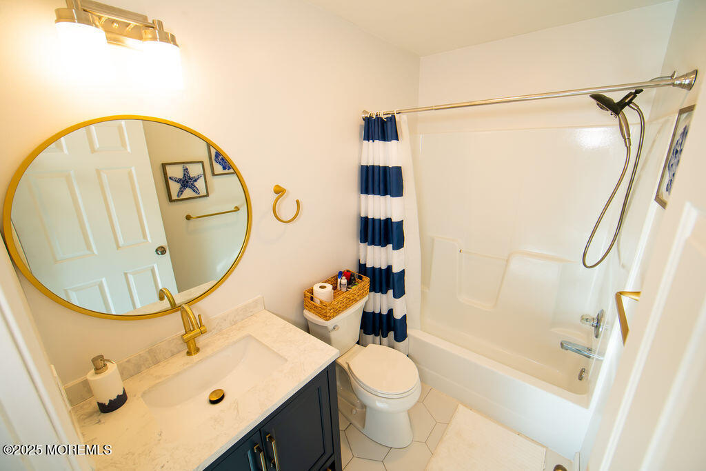 28 Central Avenue Point Pleasant Beach, NJ 08742 - Photo 11 of 20 a bathroom with a sink toilet and shower