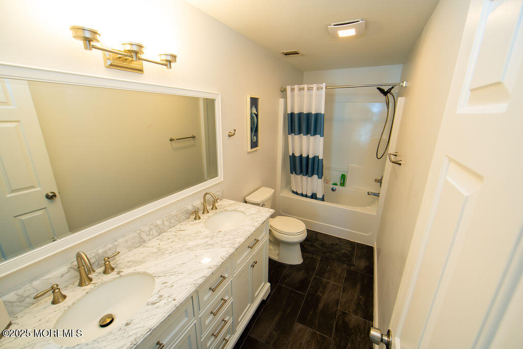 28 Central Avenue Point Pleasant Beach, NJ 08742 - Photo 12 of 20 a bathroom with a sink a toilet and shower