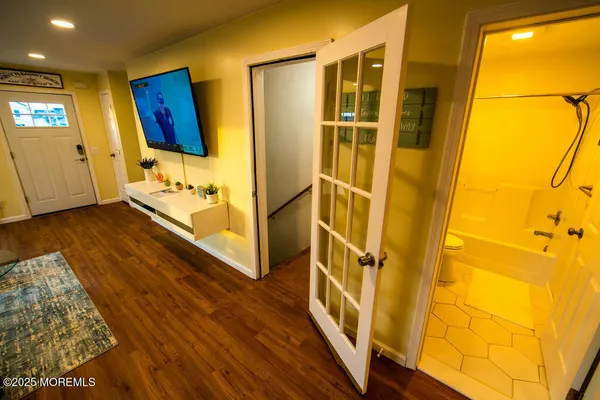 a view of front door and wooden floor