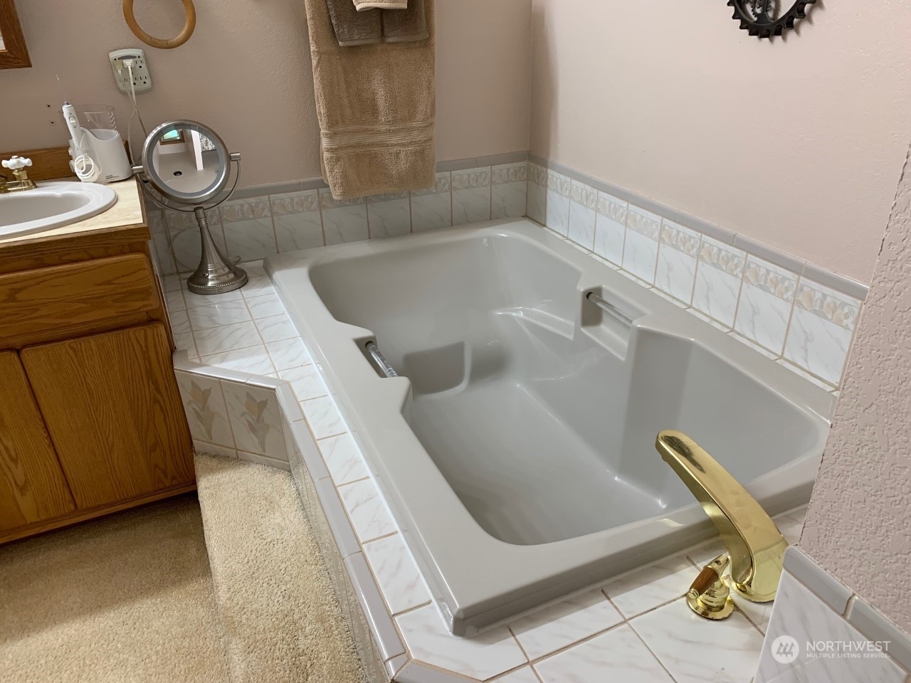 240 East Channel Drive Allyn, WA 98524 - Photo 13 of 33 a bathroom with a sink and a bathtub