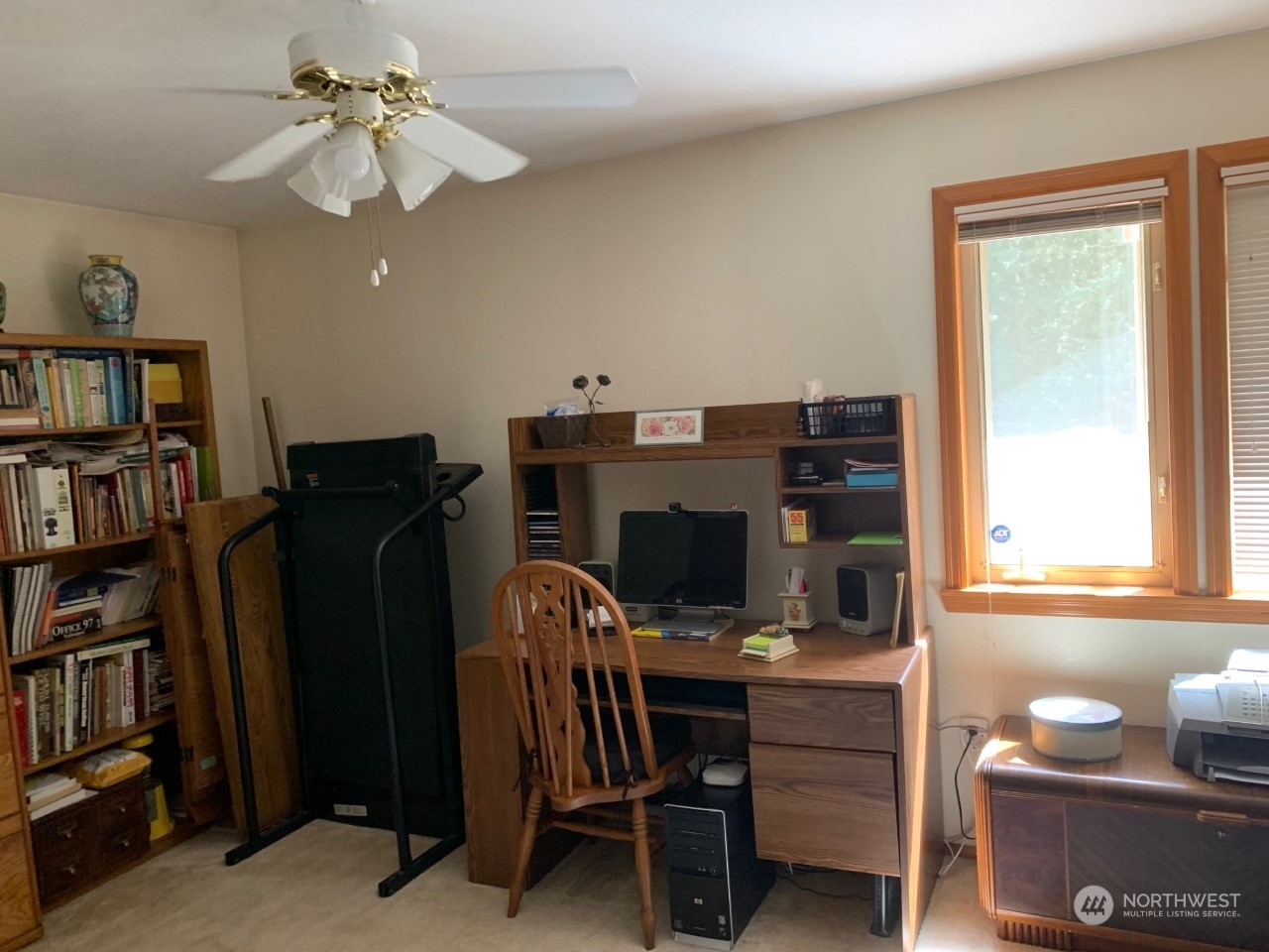 240 East Channel Drive Allyn, WA 98524 - Photo 17 of 33 a view of a workspace with furniture and a window