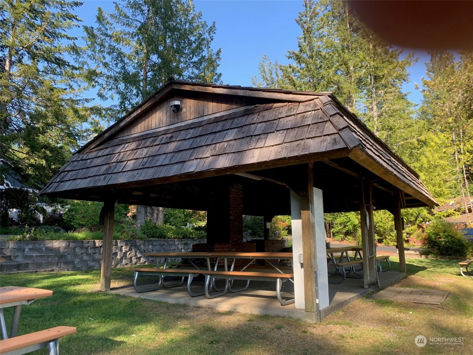 240 East Channel Drive Allyn, WA 98524 - Photo 32 of 33 a backyard of a house with wooden floor and outdoor seating
