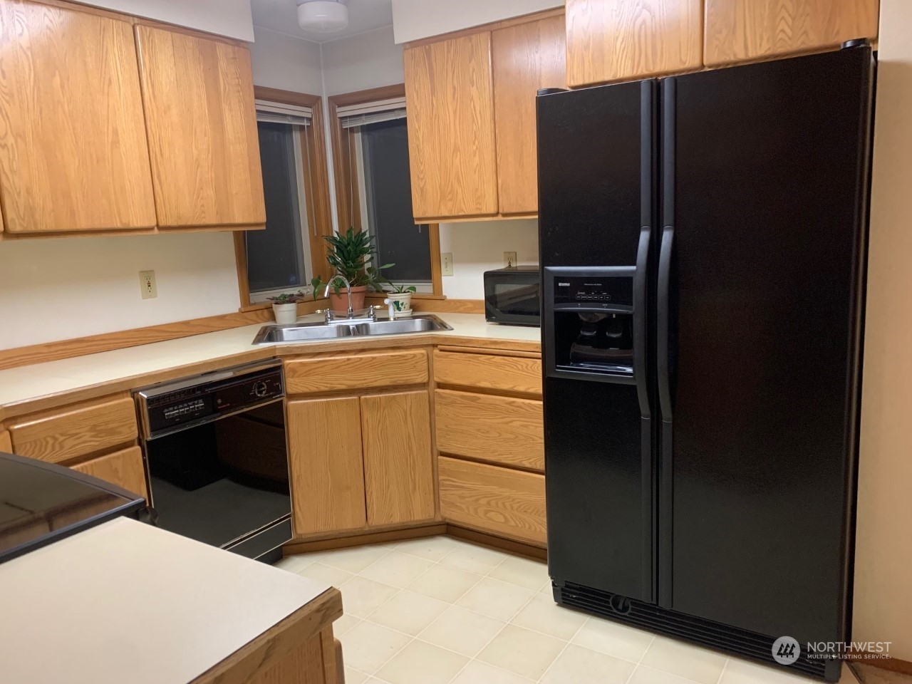 240 East Channel Drive Allyn, WA 98524 - Photo 4 of 33 a kitchen with a sink stove and refrigerator