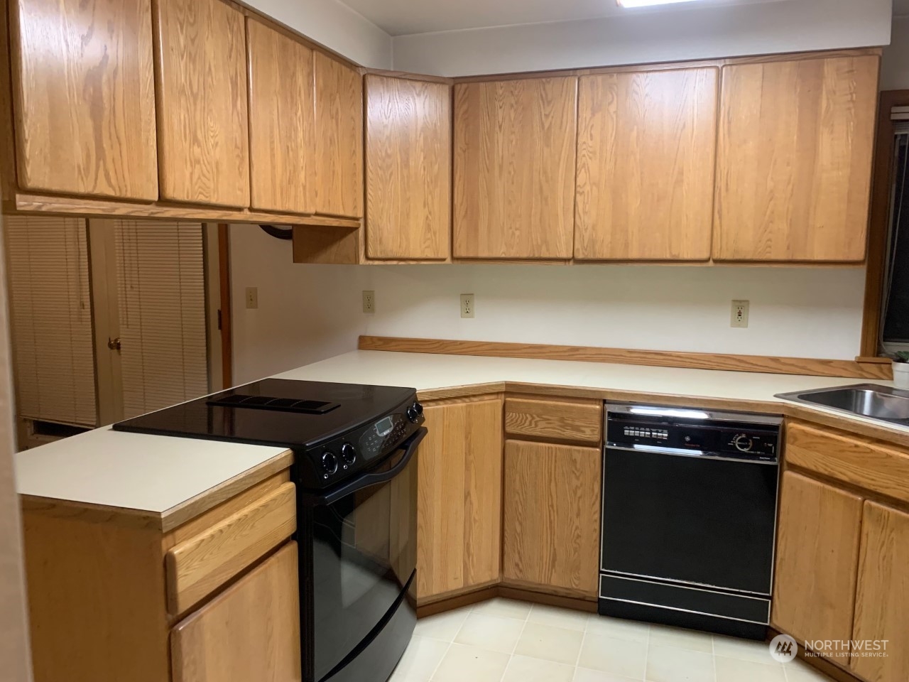 240 East Channel Drive Allyn, WA 98524 - Photo 5 of 33 a kitchen with a stove and a sink