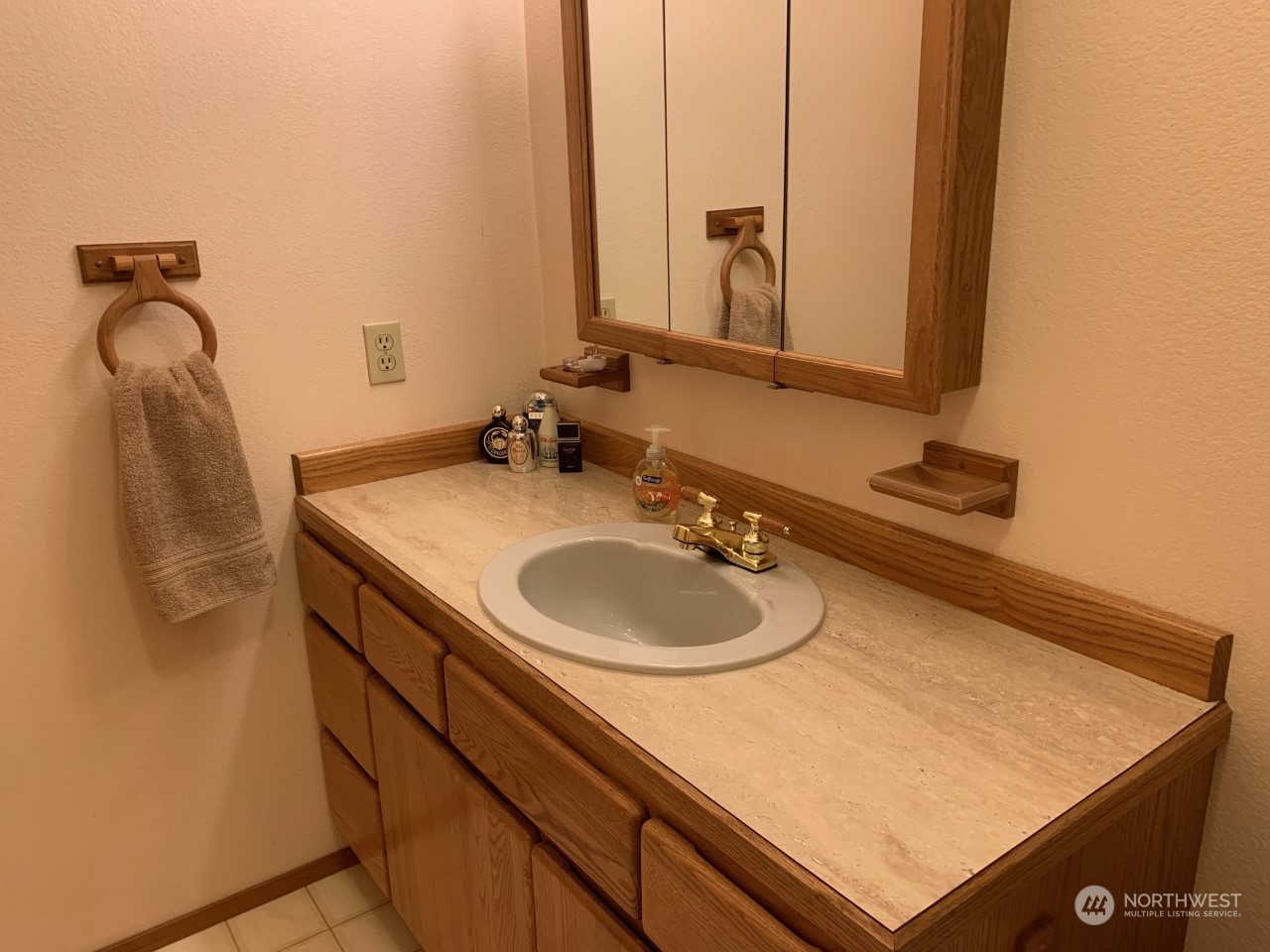 240 East Channel Drive Allyn, WA 98524 - Photo 8 of 33 a bathroom with a sink vanity and a mirror