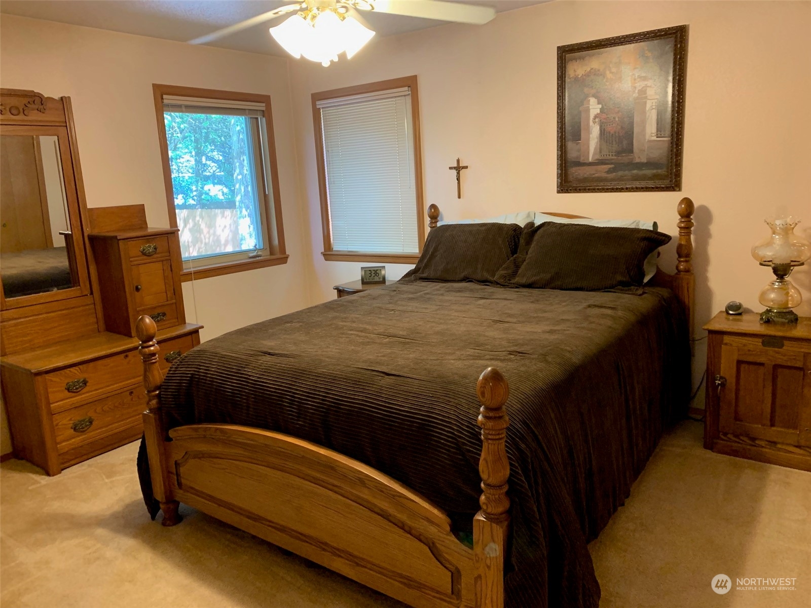 240 East Channel Drive Allyn, WA 98524 - Photo 10 of 33 a bedroom with a bed and wooden floor
