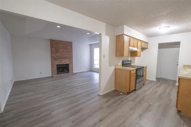 a view of kitchen with cabinets and wooden floor